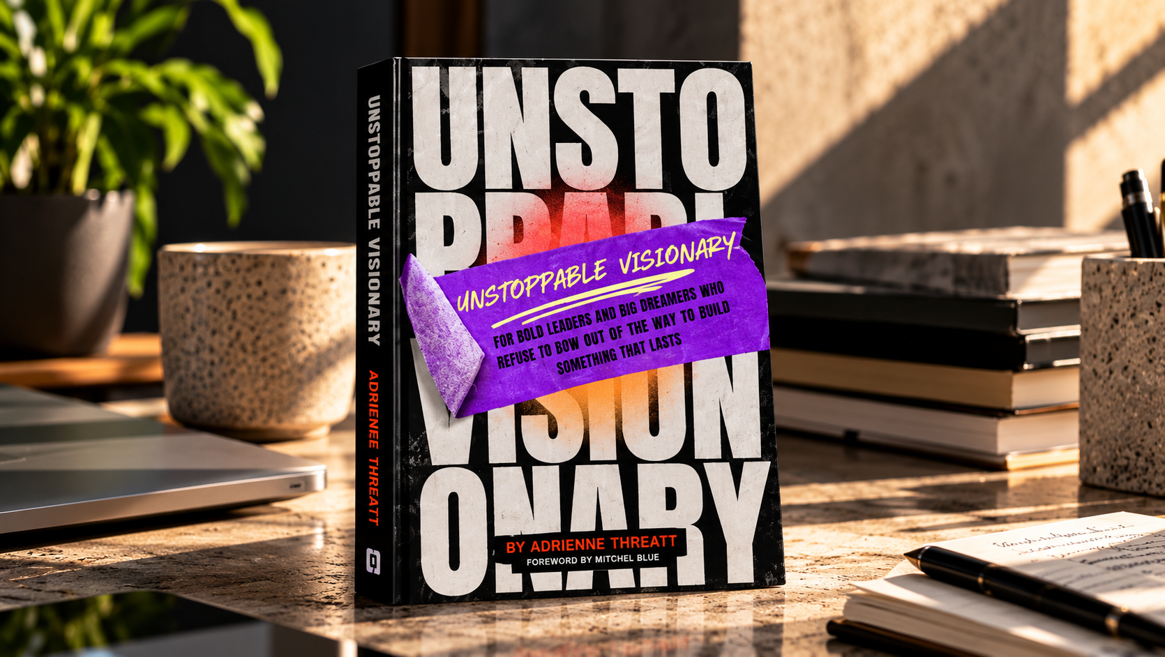 Unstoppable Visionary by Adrienne Threatt, hardcover book on a desk
